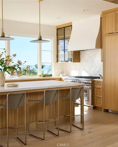 a kitchen with stainless steel appliances granite countertop a stove and a sink