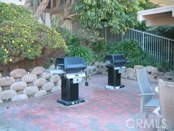 a view of a chair and table in the backyard