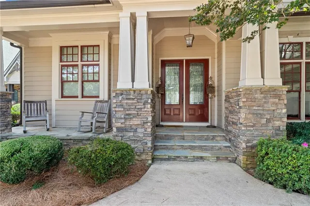 a view of front door and a bench