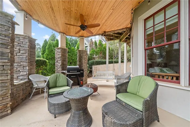 a kitchen with granite countertop white cabinets and sink