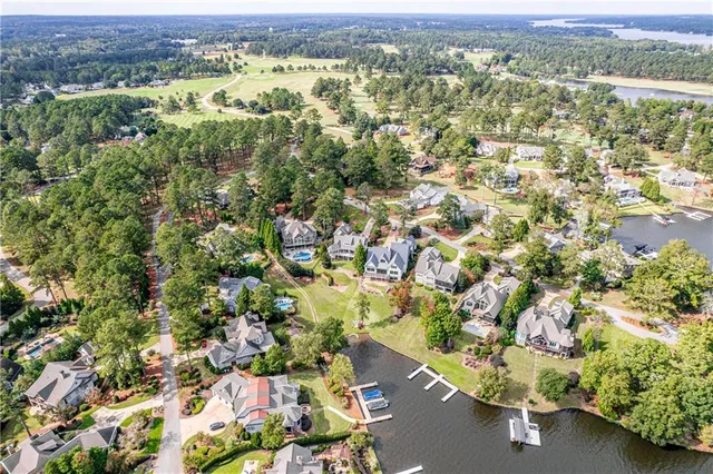 an aerial view of a house with a swimming pool yard and outdoor seating