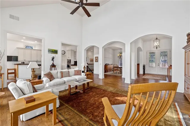 a living room with furniture a fireplace and a flat screen tv