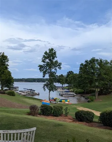 a view of a building with a yard balcony and seating area