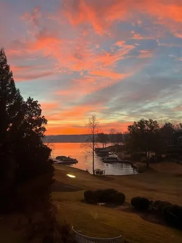 a balcony with furniture and garden view