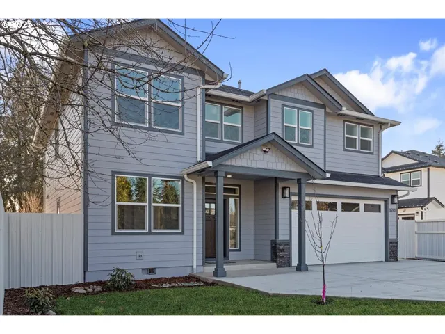 a view of a brick house with large windows