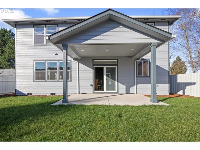 a house view with a sitting space and garden