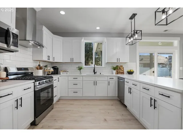 a kitchen with sink cabinets and window