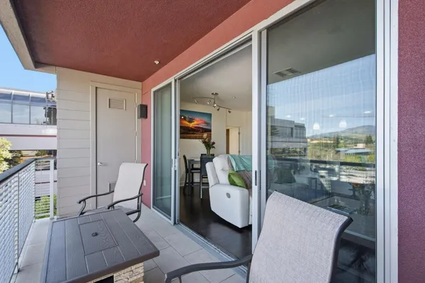a view of a balcony with wooden floor