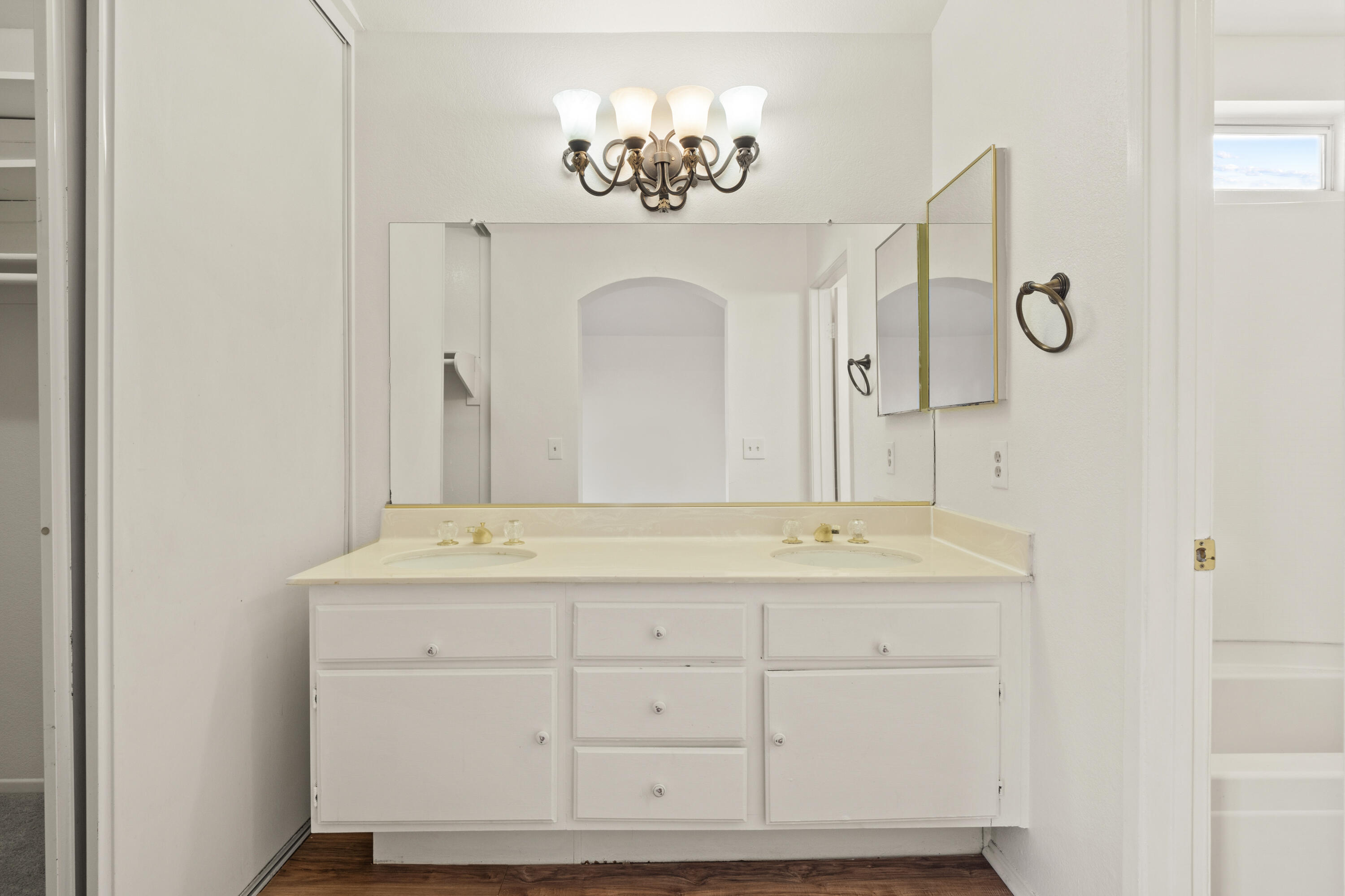 1551 Coventry Place Palmdale, CA 93551 - Photo 12 of 12 a bathroom with a double vanity sink and a mirror