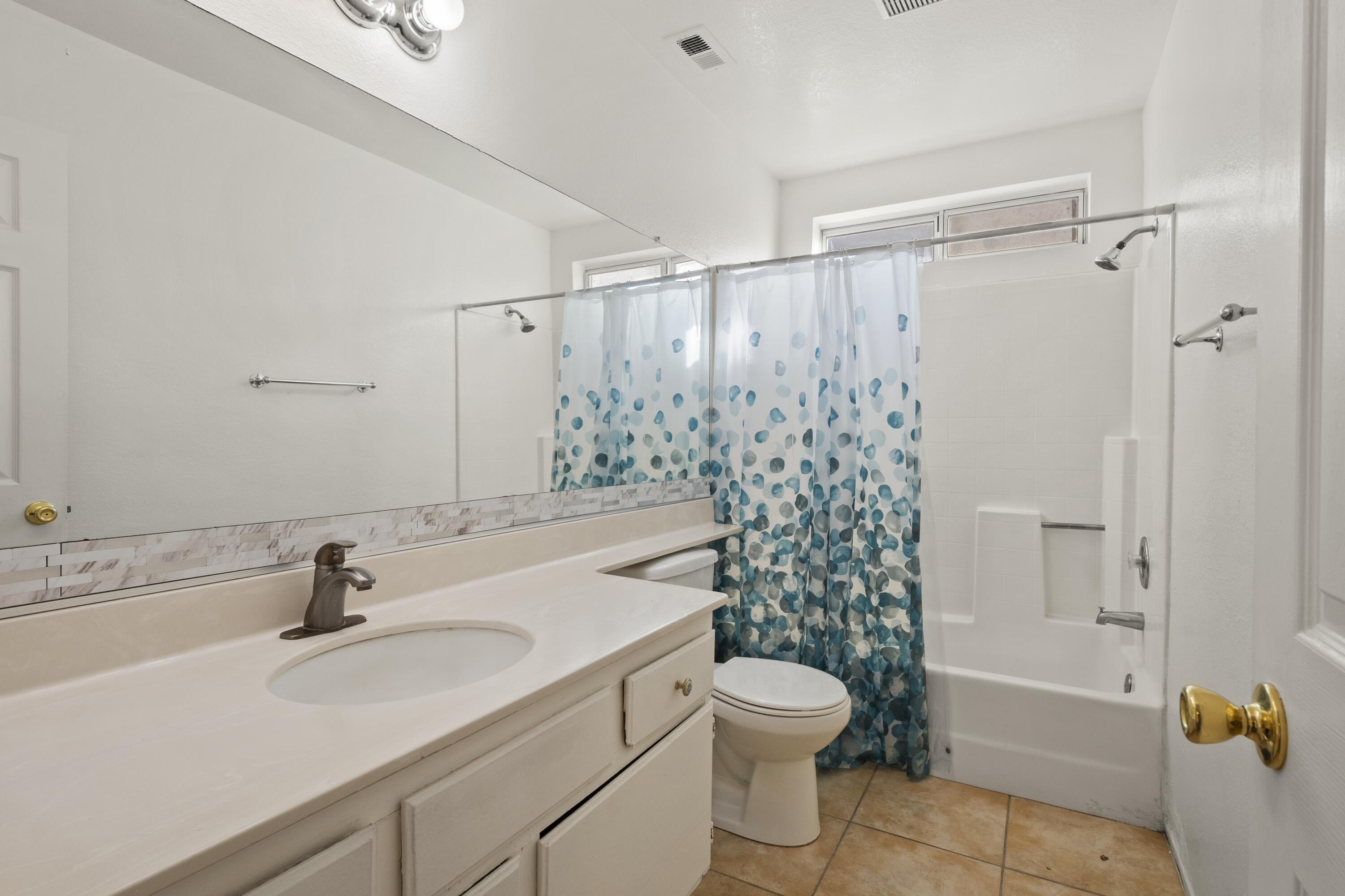 1551 Coventry Place Palmdale, CA 93551 - Photo 6 of 12 a bathroom with a sink toilet and shower