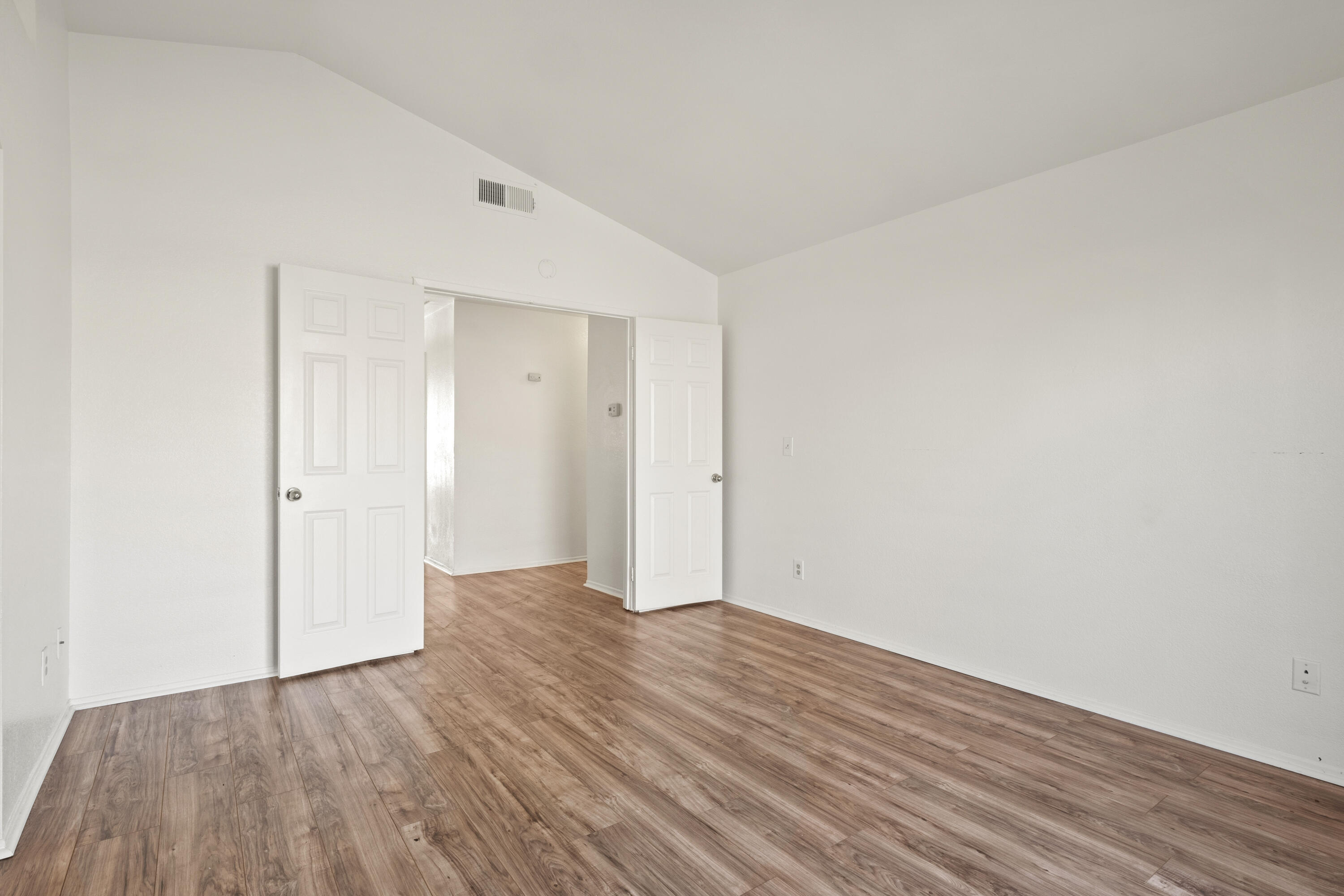 1551 Coventry Place Palmdale, CA 93551 - Photo 10 of 12 a view of an empty room with wooden floor