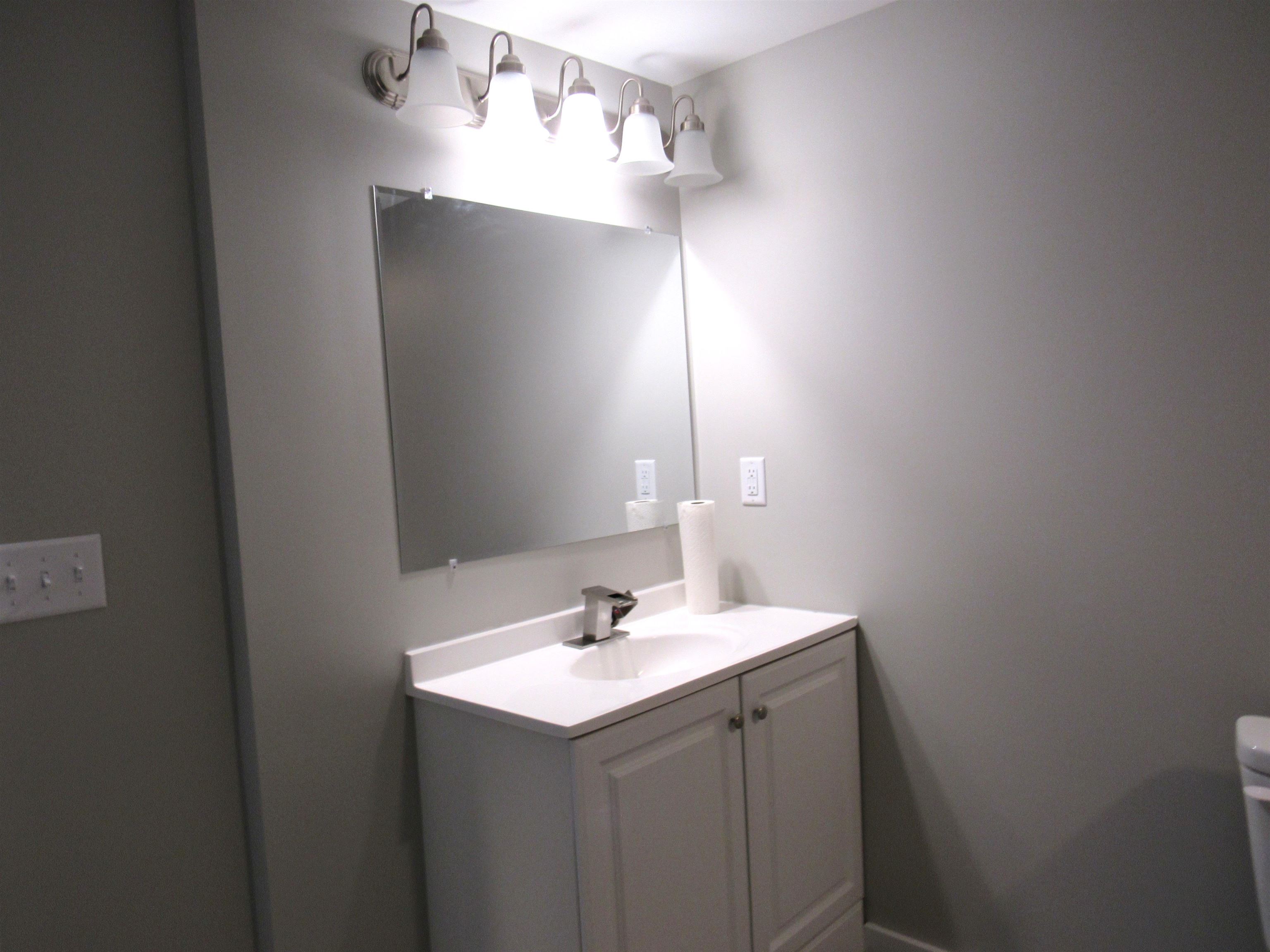 336 Belteberg Road Loves Park, IL 61111 - Photo 17 of 23 a bathroom with a sink and a mirror