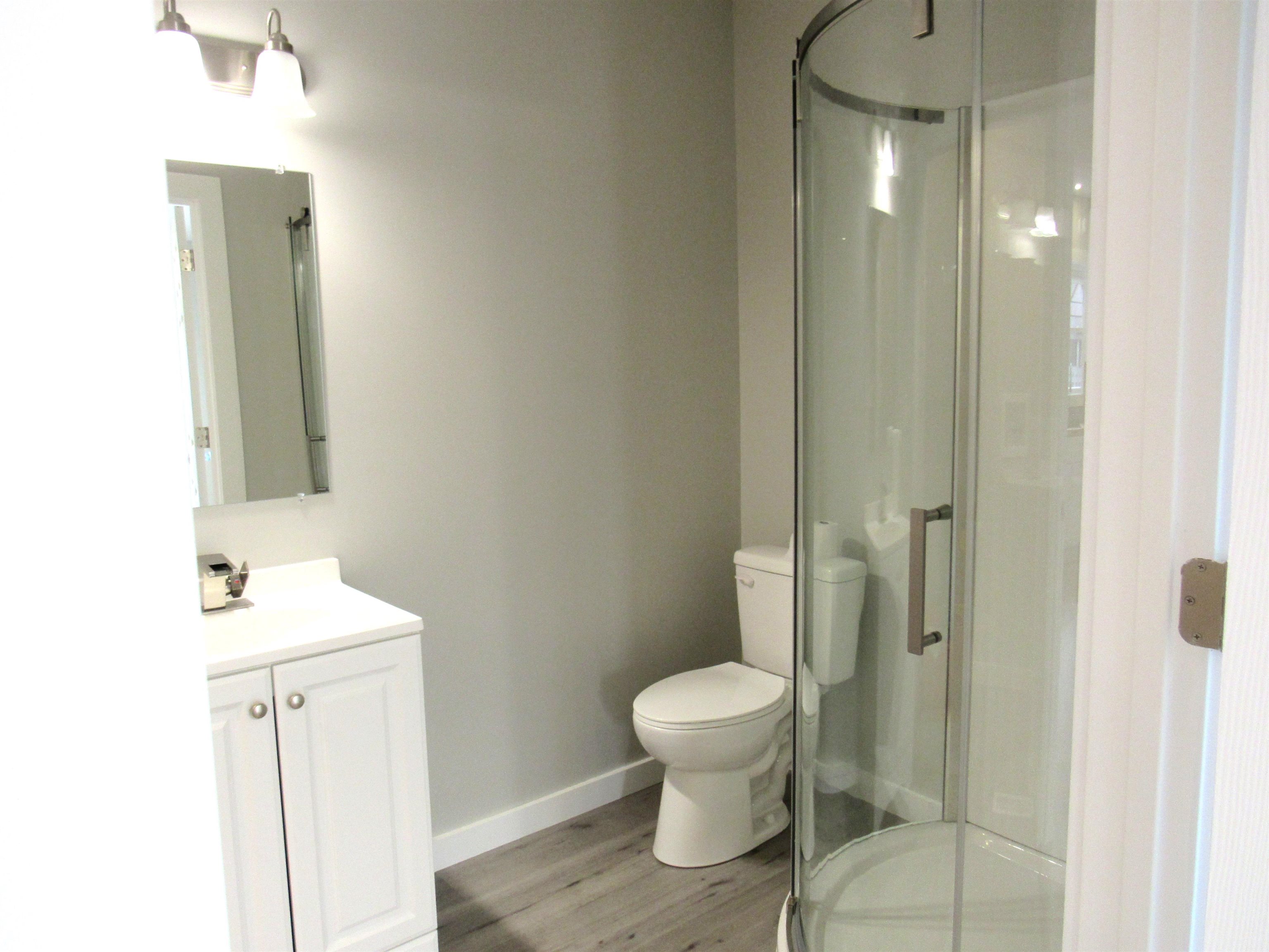 336 Belteberg Road Loves Park, IL 61111 - Photo 9 of 23 a bathroom with a sink a toilet and shower