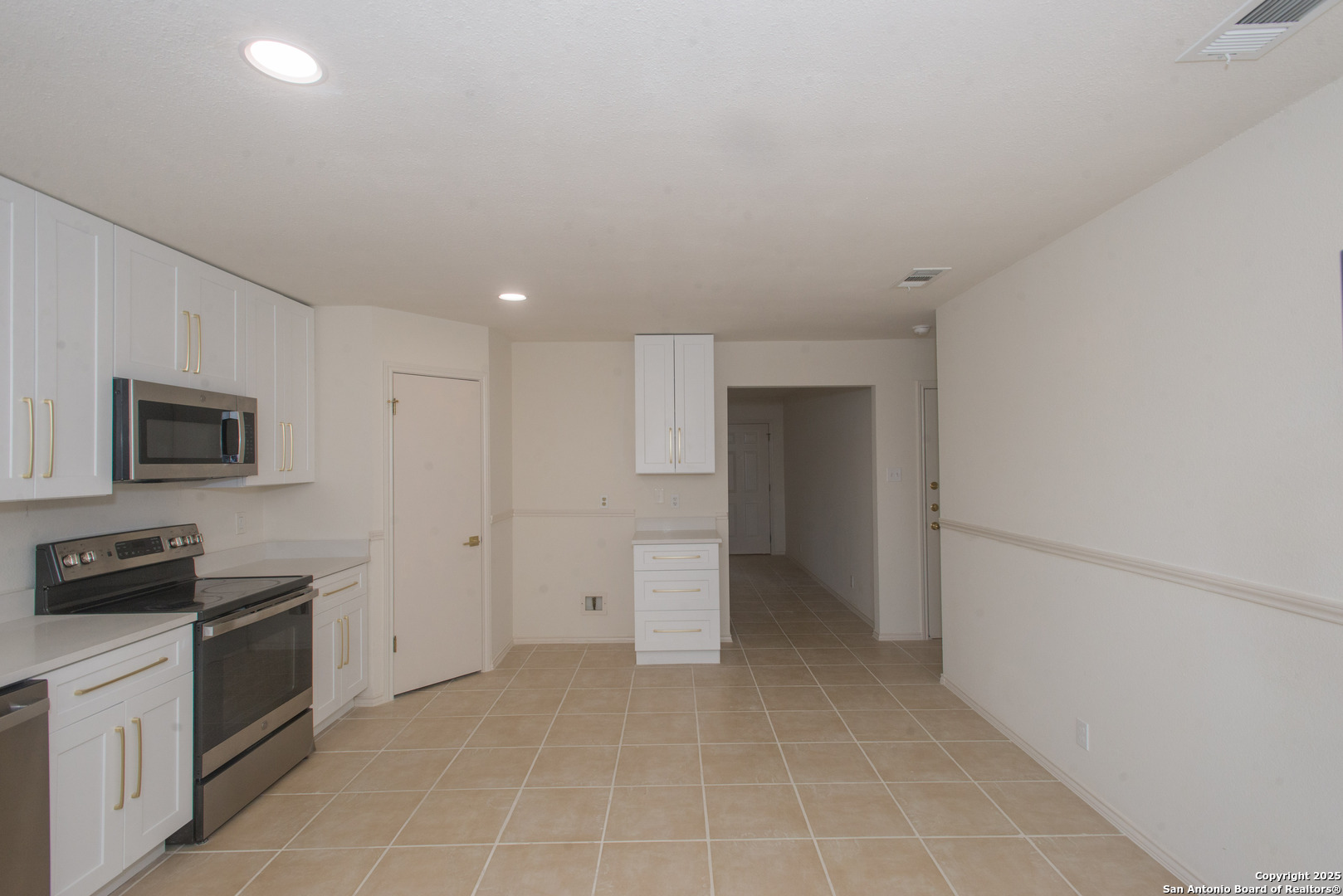 8914 Timber Run San Antonio, TX 78250 - Photo 13 of 23 a view of a kitchen with a sink stove and a refrigerator