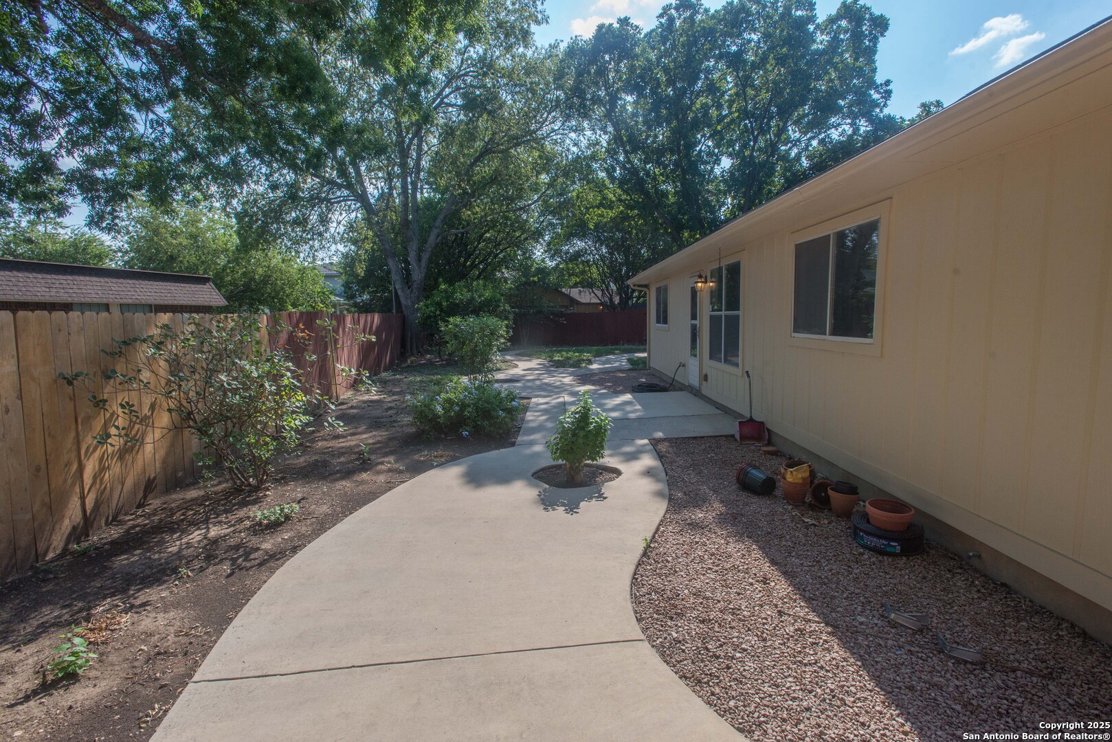 8914 Timber Run San Antonio, TX 78250 - Photo 18 of 23 a backyard of a house with yard barbeque oven and outdoor seating