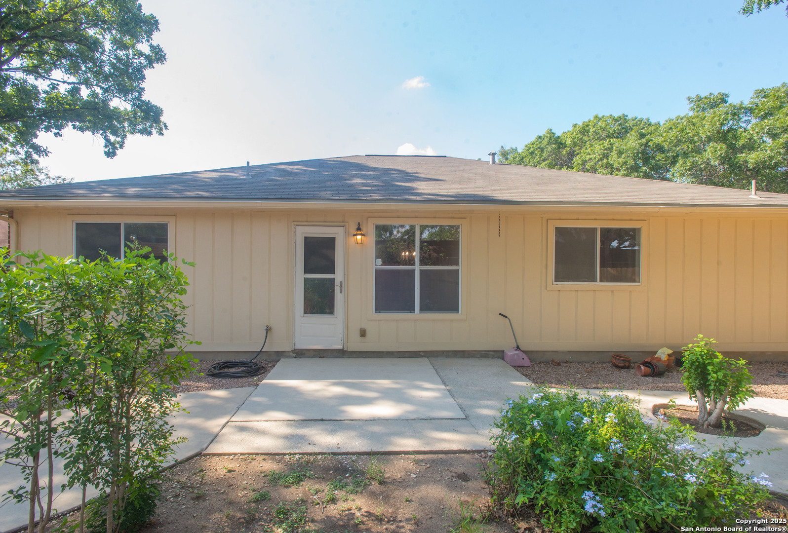 8914 Timber Run San Antonio, TX 78250 - Photo 19 of 23 a front view of a house with garden