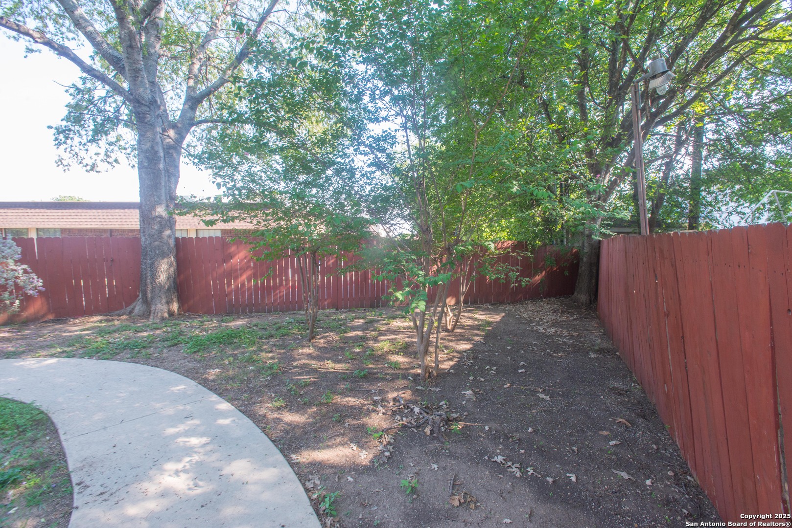 8914 Timber Run San Antonio, TX 78250 - Photo 22 of 23 a backyard of a house with lots of green space