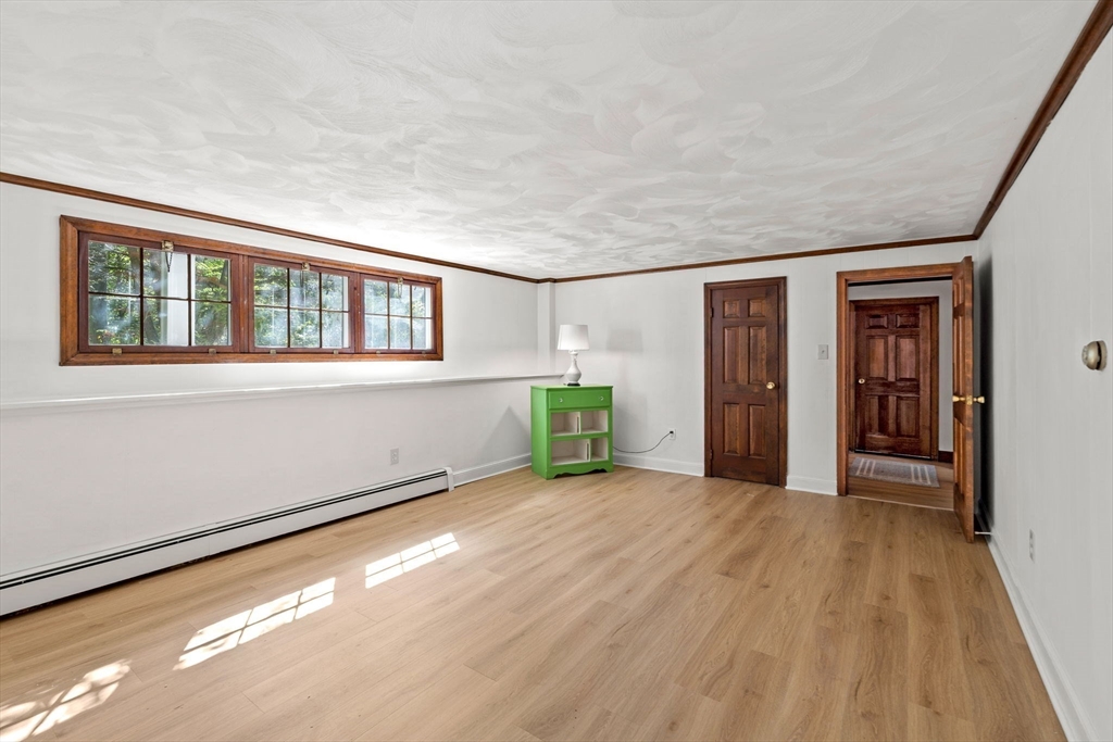 371 Longley Road Groton, MA 01450 - Photo 23 of 33 a view of an empty room with closet and a window