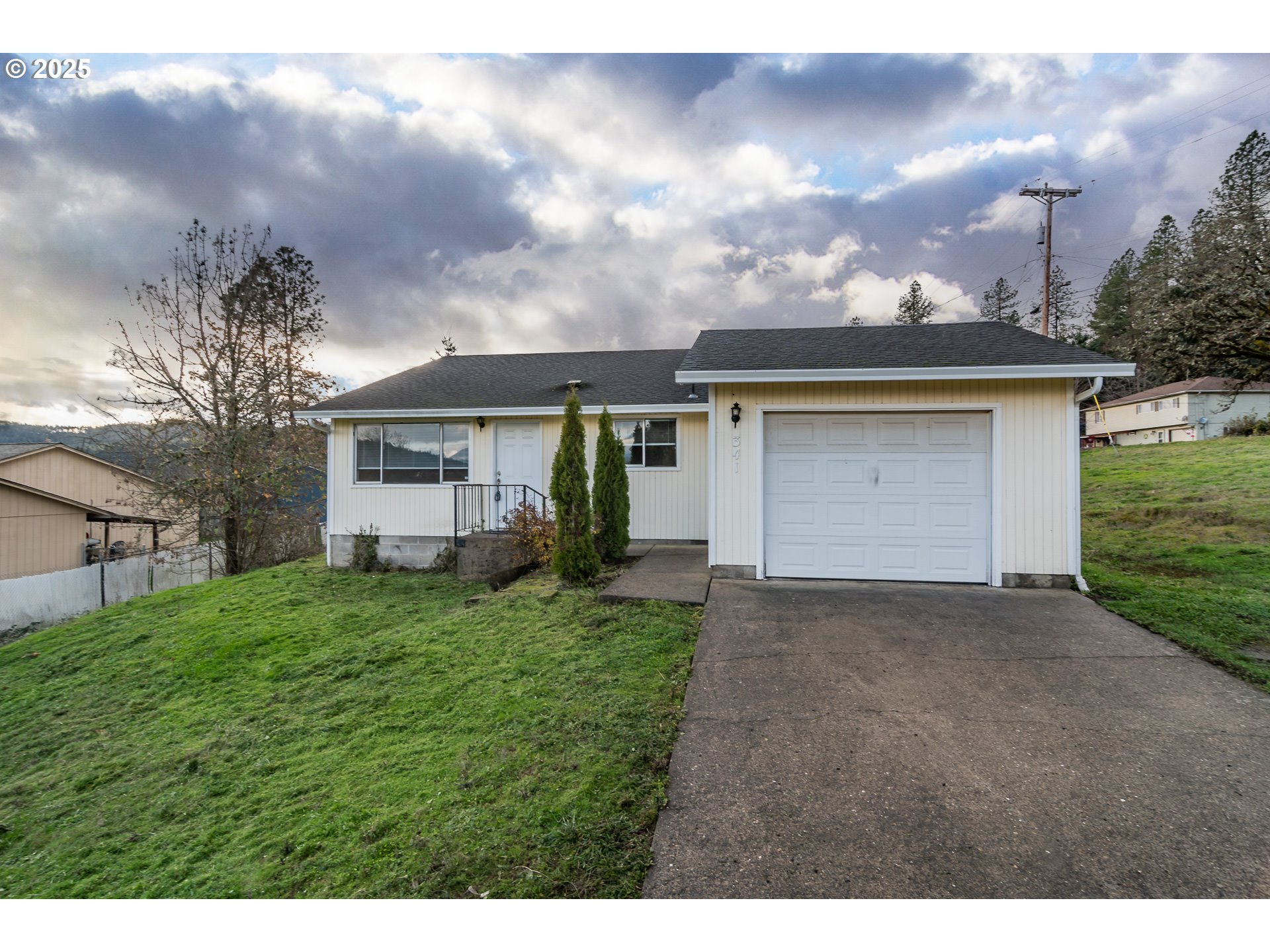 341 Ash Street Sutherlin, OR 97479 - Photo 1 of 28 a view of a house with a back yard