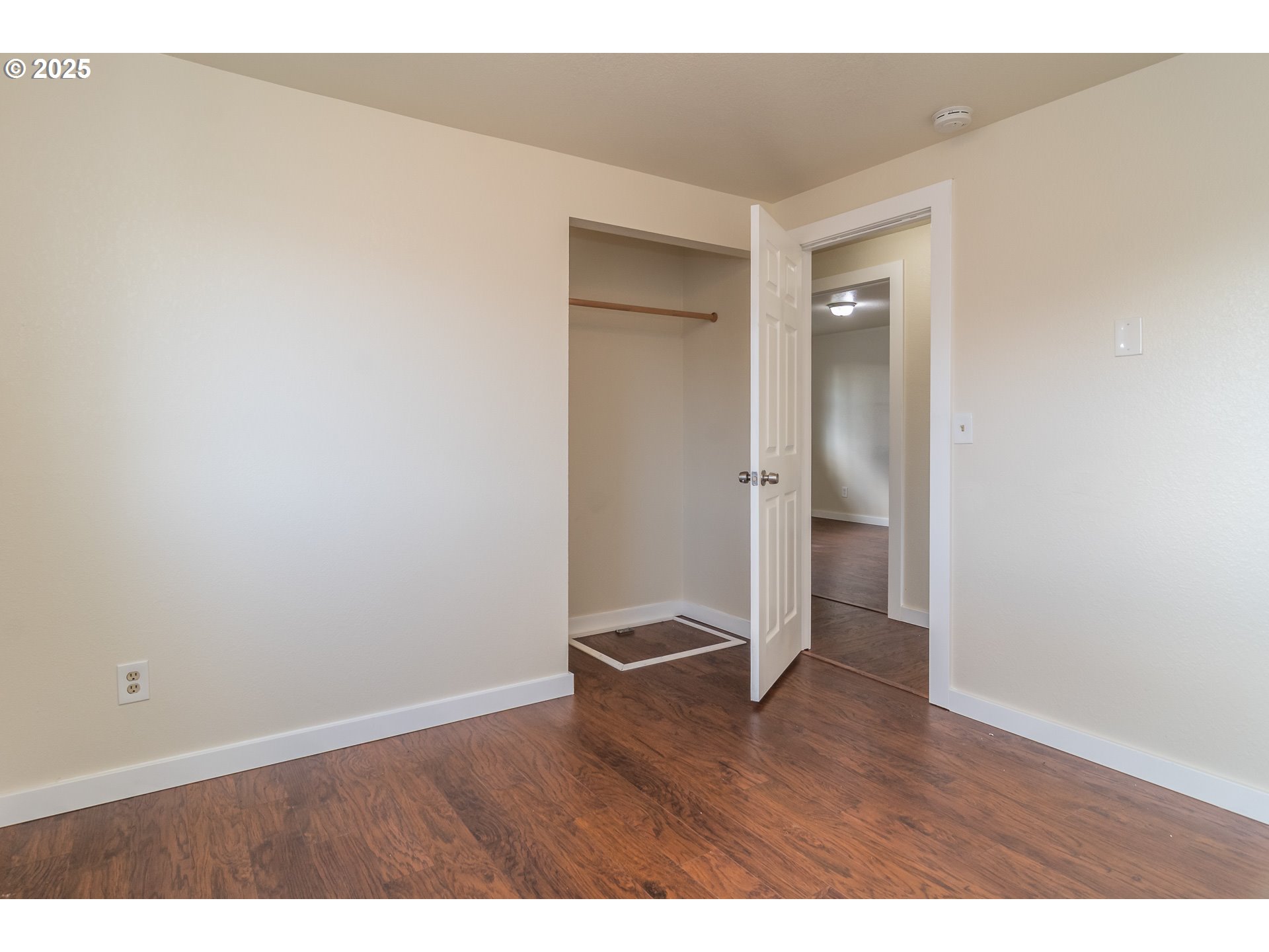 341 Ash Street Sutherlin, OR 97479 - Photo 13 of 28 a view of an empty room with wooden floor