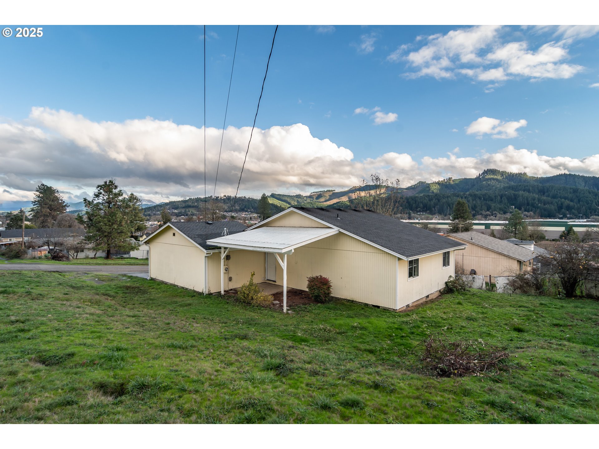 341 Ash Street Sutherlin, OR 97479 - Photo 23 of 28 a aerial view of a house with backyard porch and garden