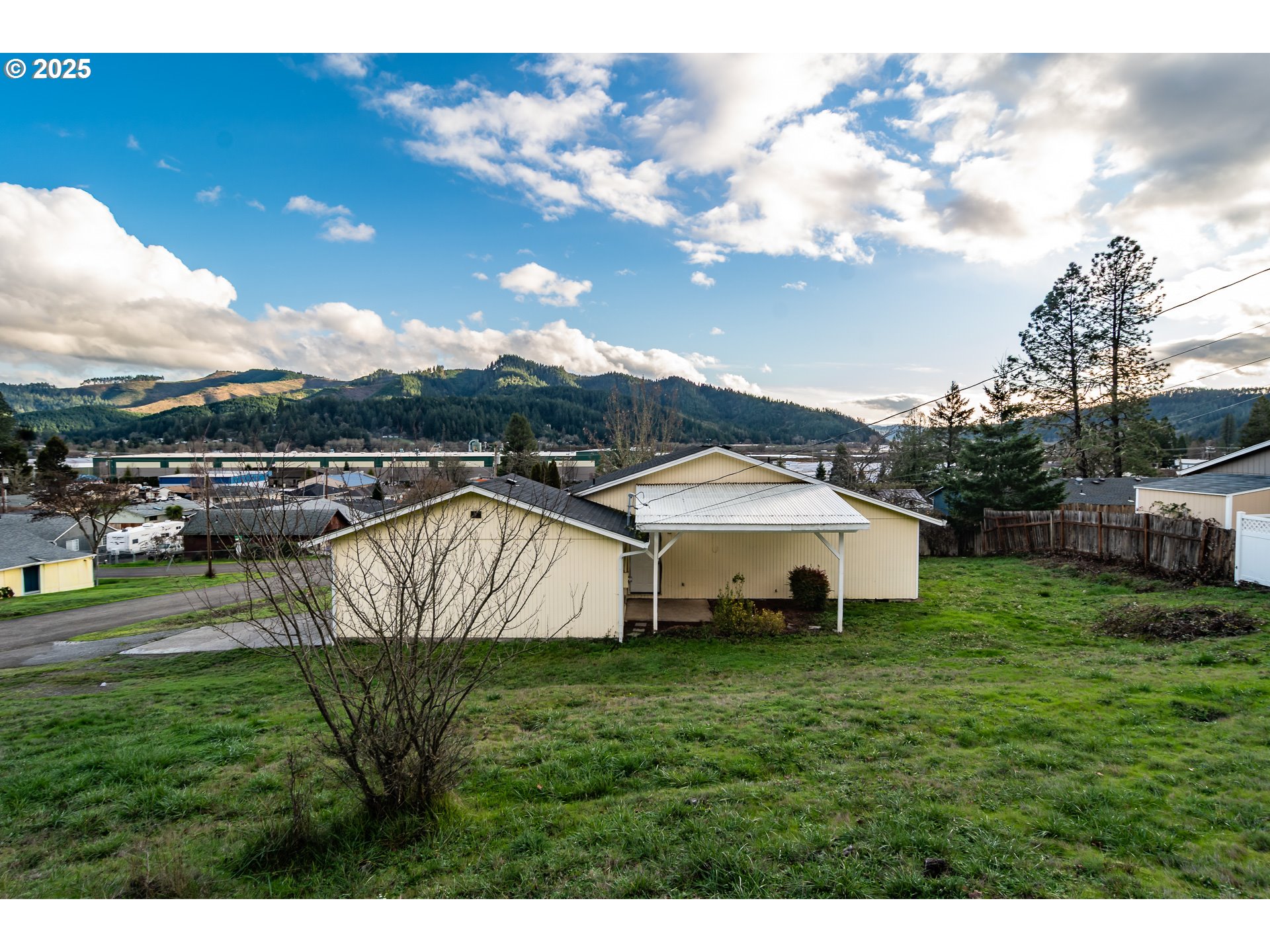 341 Ash Street Sutherlin, OR 97479 - Photo 24 of 28 a view of a house with a yard and sitting area