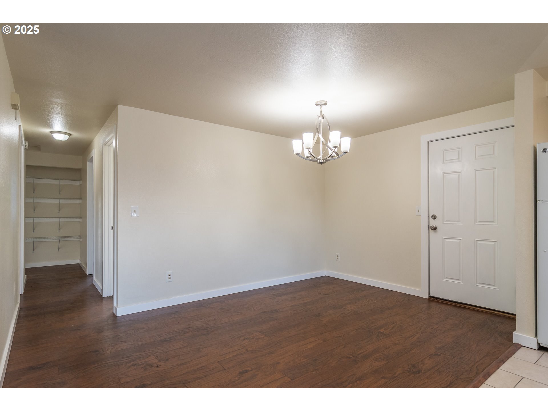 341 Ash Street Sutherlin, OR 97479 - Photo 5 of 28 a view of an empty room with wooden floor