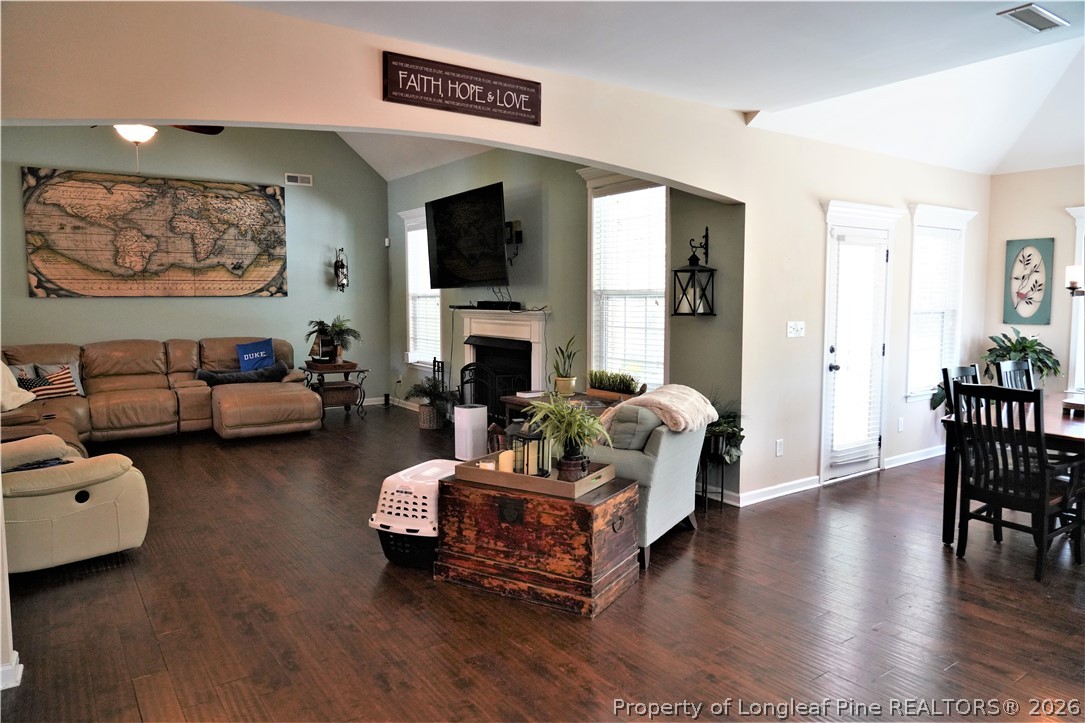 930 Old Vander Road Fayetteville, NC 28312 - Photo 12 of 45 a living room with furniture and a fireplace