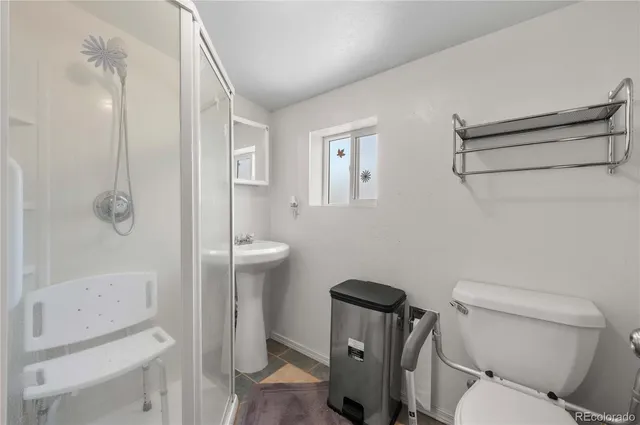 an empty room with closet and windows