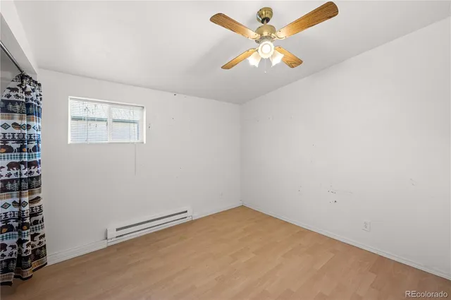 a bathroom with a granite countertop toilet sink and shower