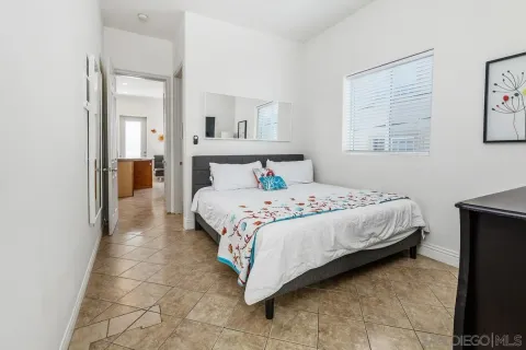 a bedroom with a bed and a cabinets