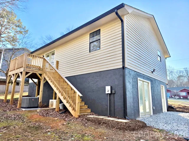 a view of a house with wooden stairs