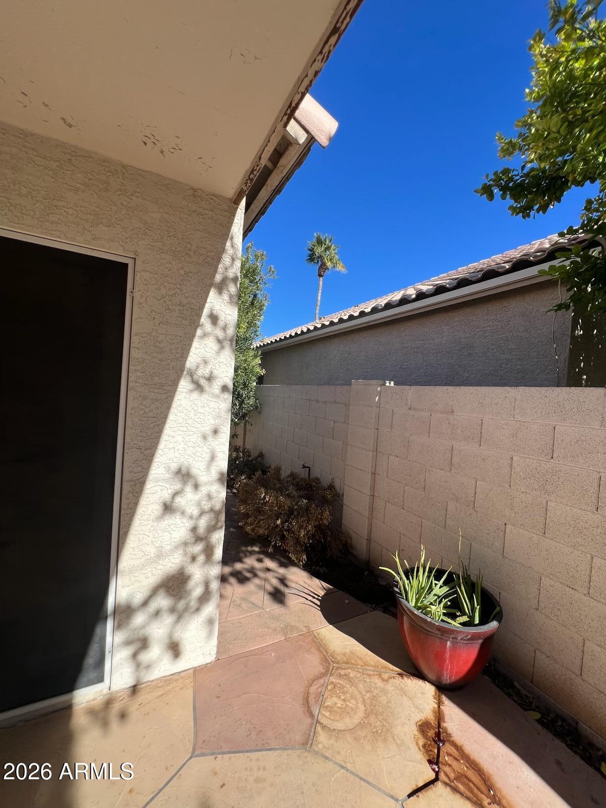261 West Verano Place Gilbert, AZ 85233 - Photo 16 of 17 a backyard of a house with a table and chairs