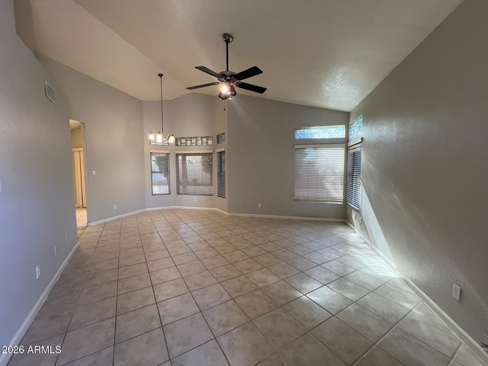 261 West Verano Place Gilbert, AZ 85233 - Photo 3 of 17 a view of an empty room and a ceiling fan
