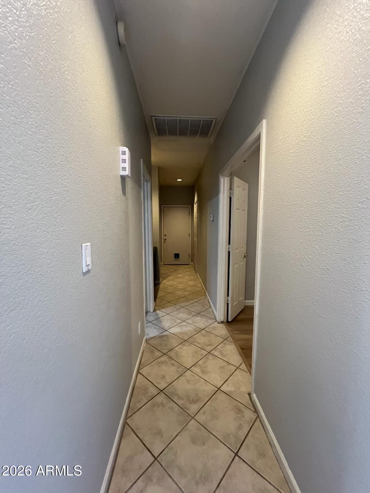 261 West Verano Place Gilbert, AZ 85233 - Photo 8 of 17 a view of a hallway with wooden floor