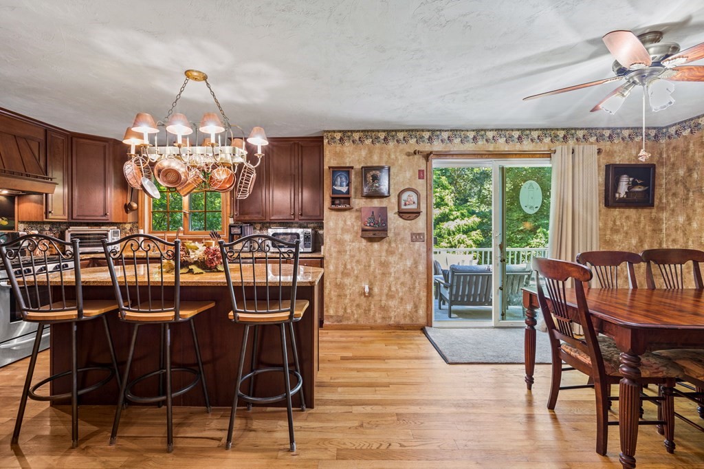 28 Crowell Road Bourne, MA 02562 - Photo 14 of 42 a view of a dining room with furniture wooden floor and chandelier