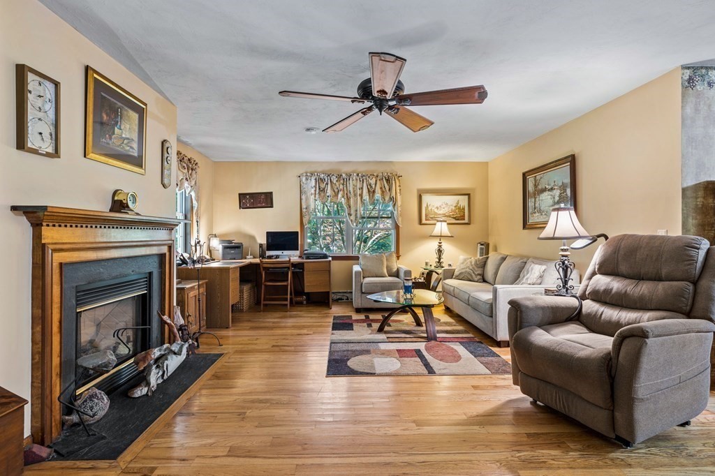 28 Crowell Road Bourne, MA 02562 - Photo 21 of 42 a living room with furniture fireplace and window