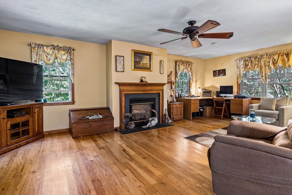 28 Crowell Road Bourne, MA 02562 - Photo 22 of 42 a living room with furniture and a flat screen tv