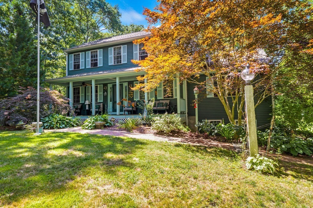 28 Crowell Road Bourne, MA 02562 - Photo 3 of 42 a front view of a house with garden