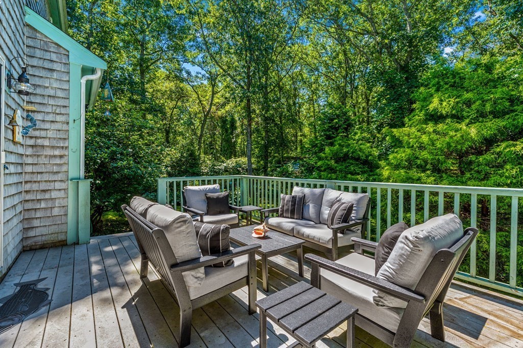 28 Crowell Road Bourne, MA 02562 - Photo 32 of 42 a view of a patio with a table and chairs