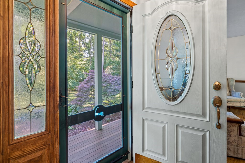 28 Crowell Road Bourne, MA 02562 - Photo 9 of 42 a view of a house with entryway wooden floor and glass door