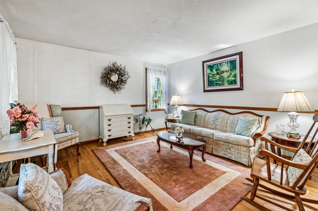 28 Crowell Road Bourne, MA 02562 - Photo 10 of 42 a living room with furniture and wooden floor