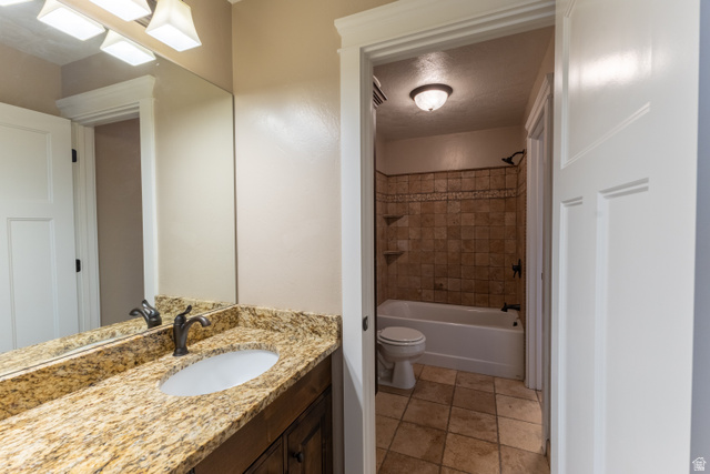 3565 West 1350th Street North Vernal, UT 84078 - Photo 29 of 54 Bathroom featuring a vanity with a granite countertop, oval undermount sink, and a bronze-finish faucet
