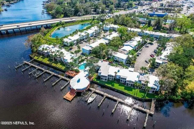 an aerial view of a swimming pool patio swimming pool and outdoor seating