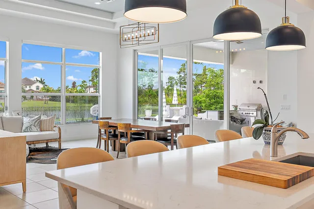 a kitchen with a refrigerator and window