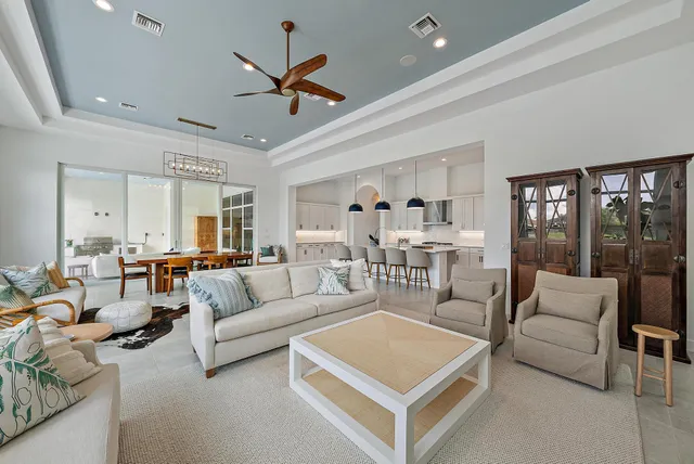 a living room with couch and a large window