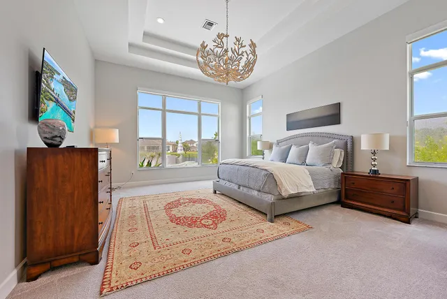 a bathroom with a tub shower and mirror