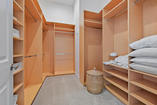 a bedroom with bed and window