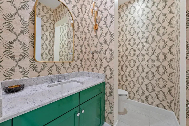 a spacious bedroom with a bed and a window