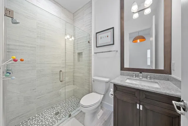 a view of a terrace with furniture and a garden